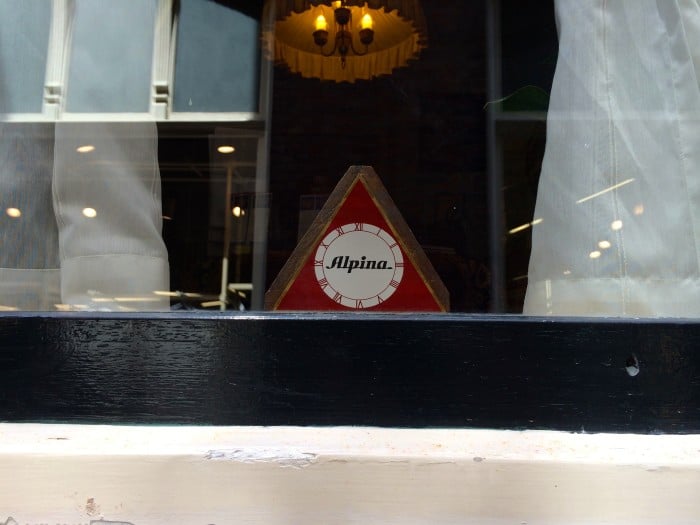 The Alpina triangle in the window of the Corrie ten Boom House Haarlem, Netherlands.