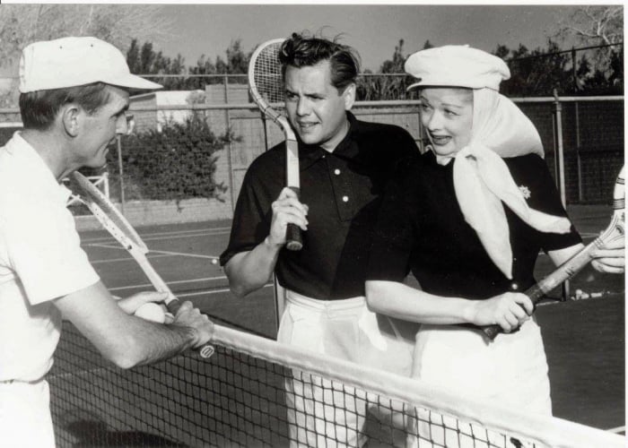 Desi Arnaz and Lucille Ball with tennis rackets