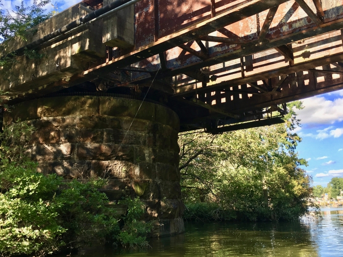 rusty trestle over a river