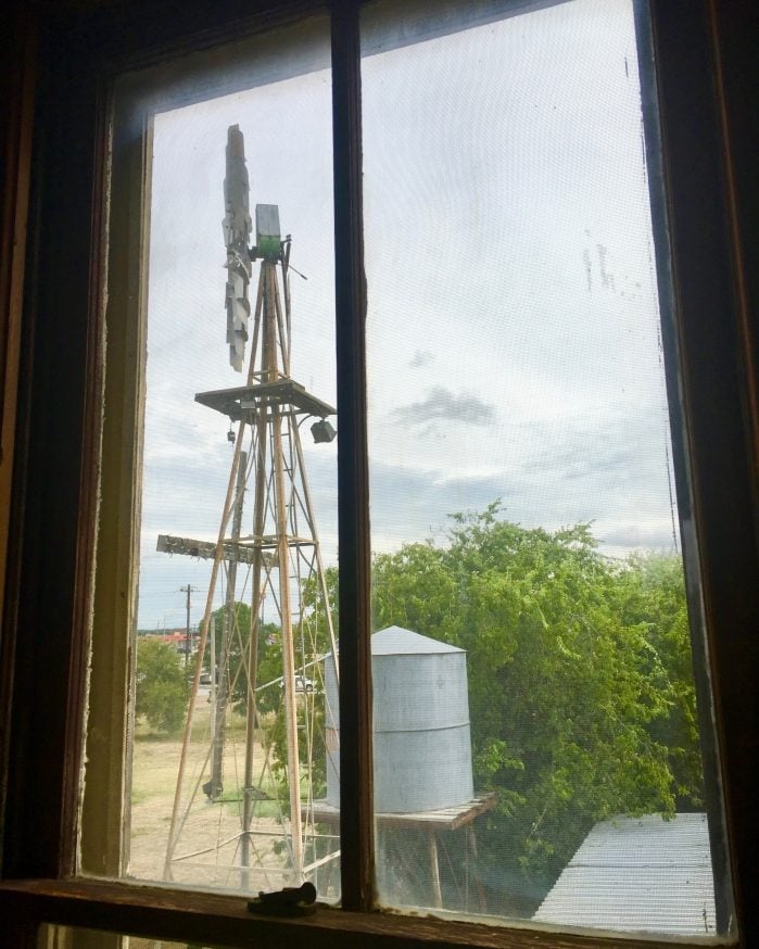 windmill and water tank through a window