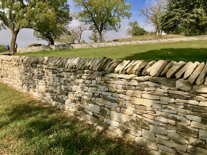 stone fence and trees