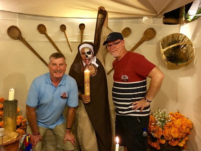 two men with a scary nun